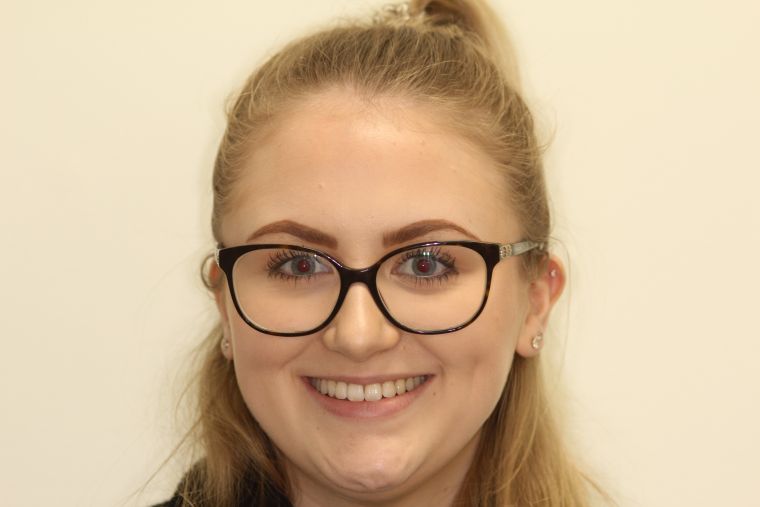 Portrait of kirsty smiling following her dental treatment.